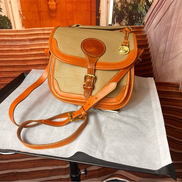 Dooney & Bourke Handbags - Y2K Dooney & Bourke Tan and Orange Saddle Crossbody Bag, buckle close, charm